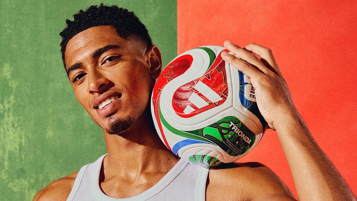 Male model holding the Trionda soccer ball